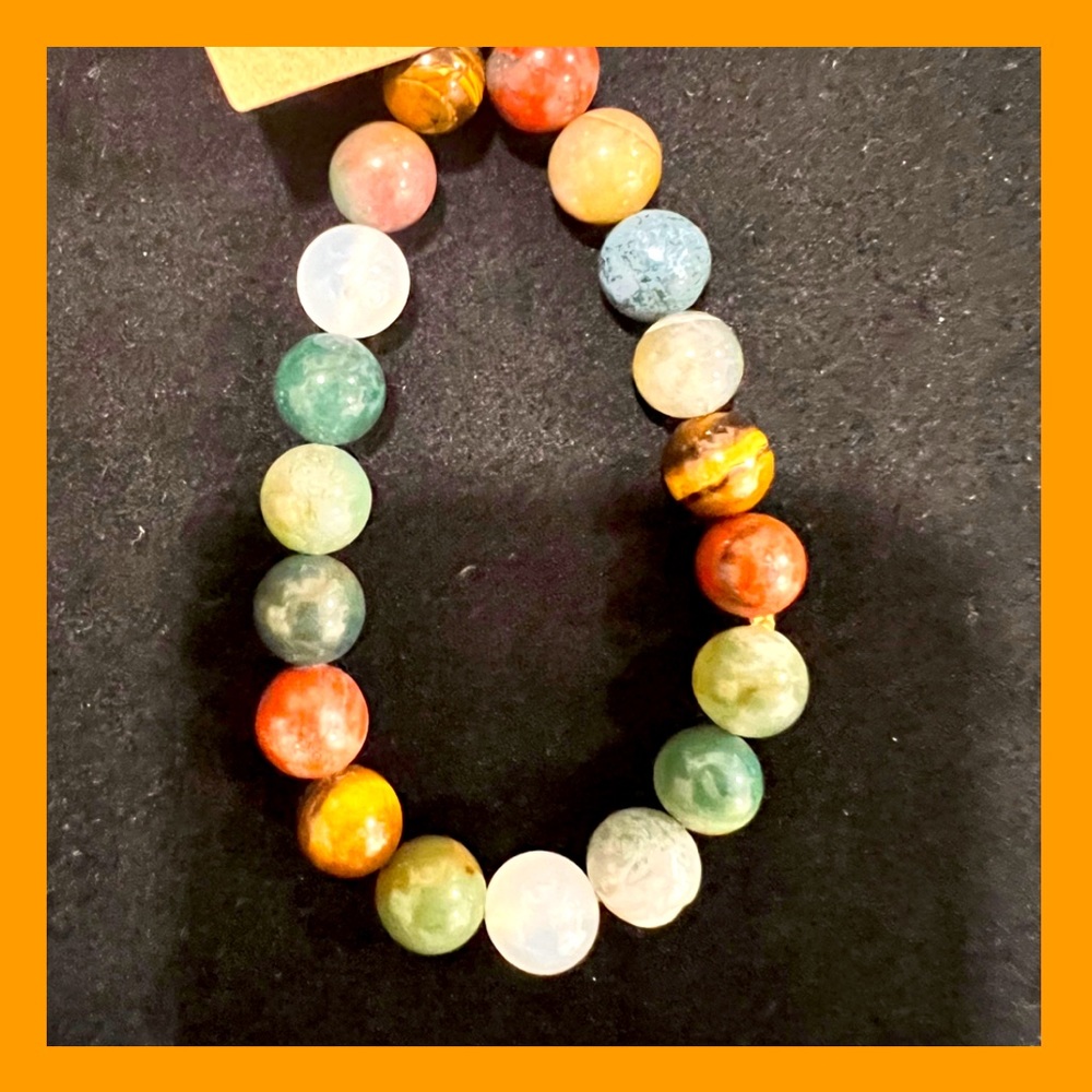 BRAND NEW! Women’s stretchy multicoloured bracelet. Greens, browns & rust.